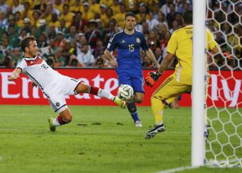 Mario Gotze scores the winning goal against Argentina, as shown in possibly the penultimate game photo of the tournament.
